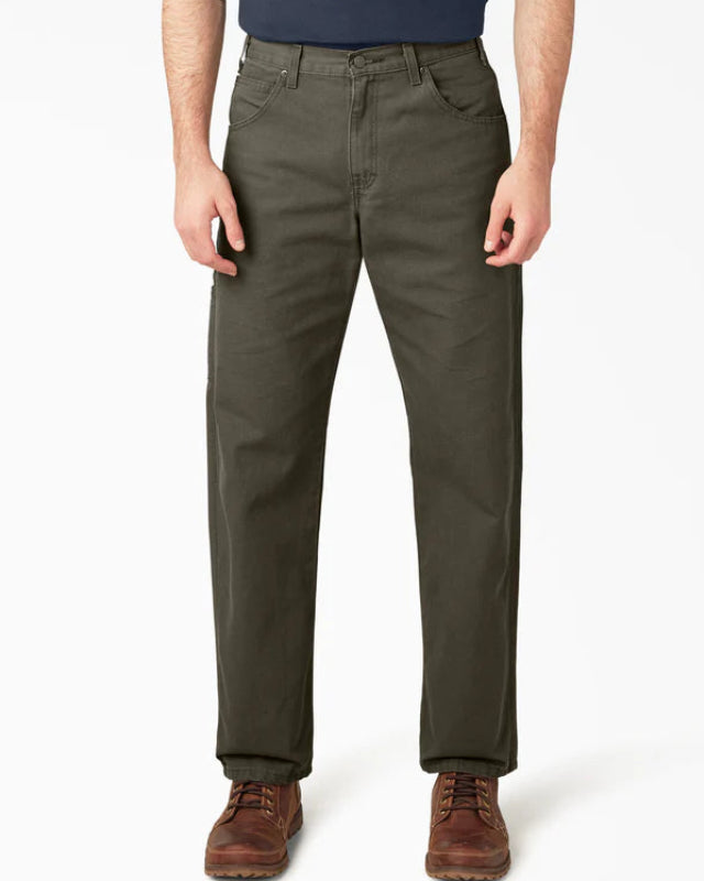 Person wearing olive green pants on a white background