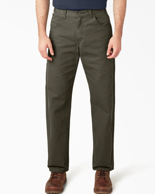 Person wearing olive green pants on a white background
